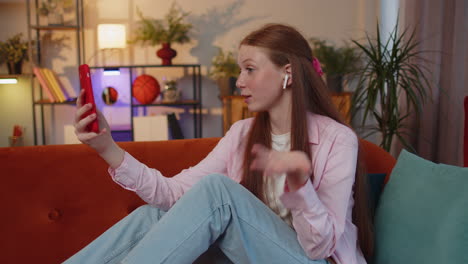 teen child girl kid making phone conversation call with family sitting on couch at home in room