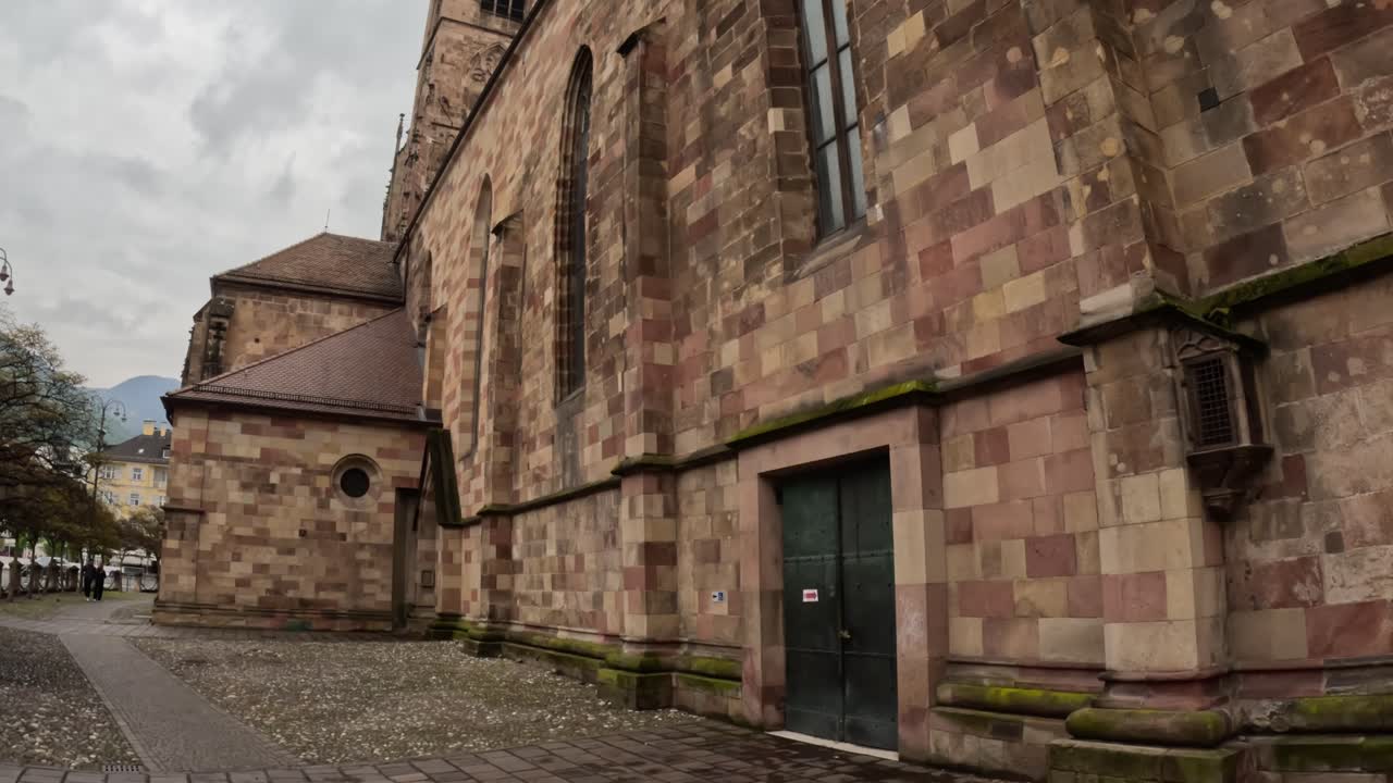 Aged stone and modern elements blend on the exterior walls of Castel Roncolo