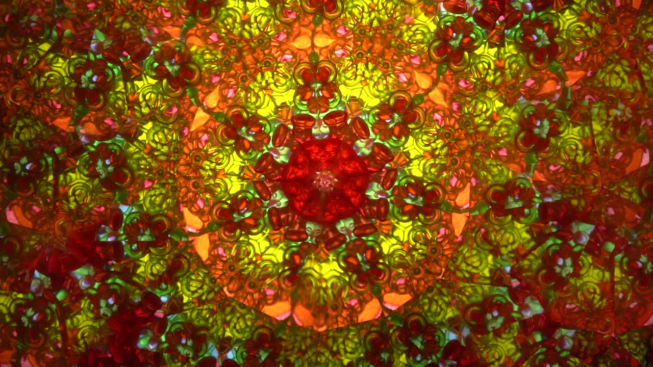 Real kaleidoscope with abstract background. View in colored fractals.