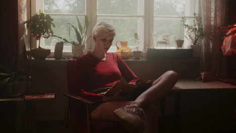 woman reading in a cozy retro home