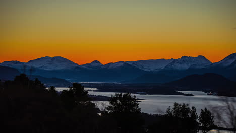 golden sunrise over the mountains, fjord, and islands at alesund, norway - time lapse