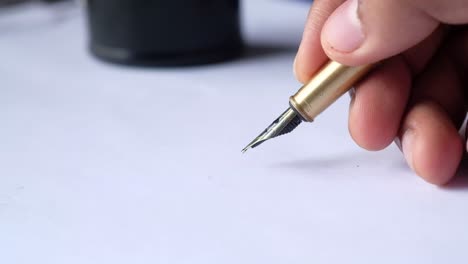 hand writing with a fountain pen