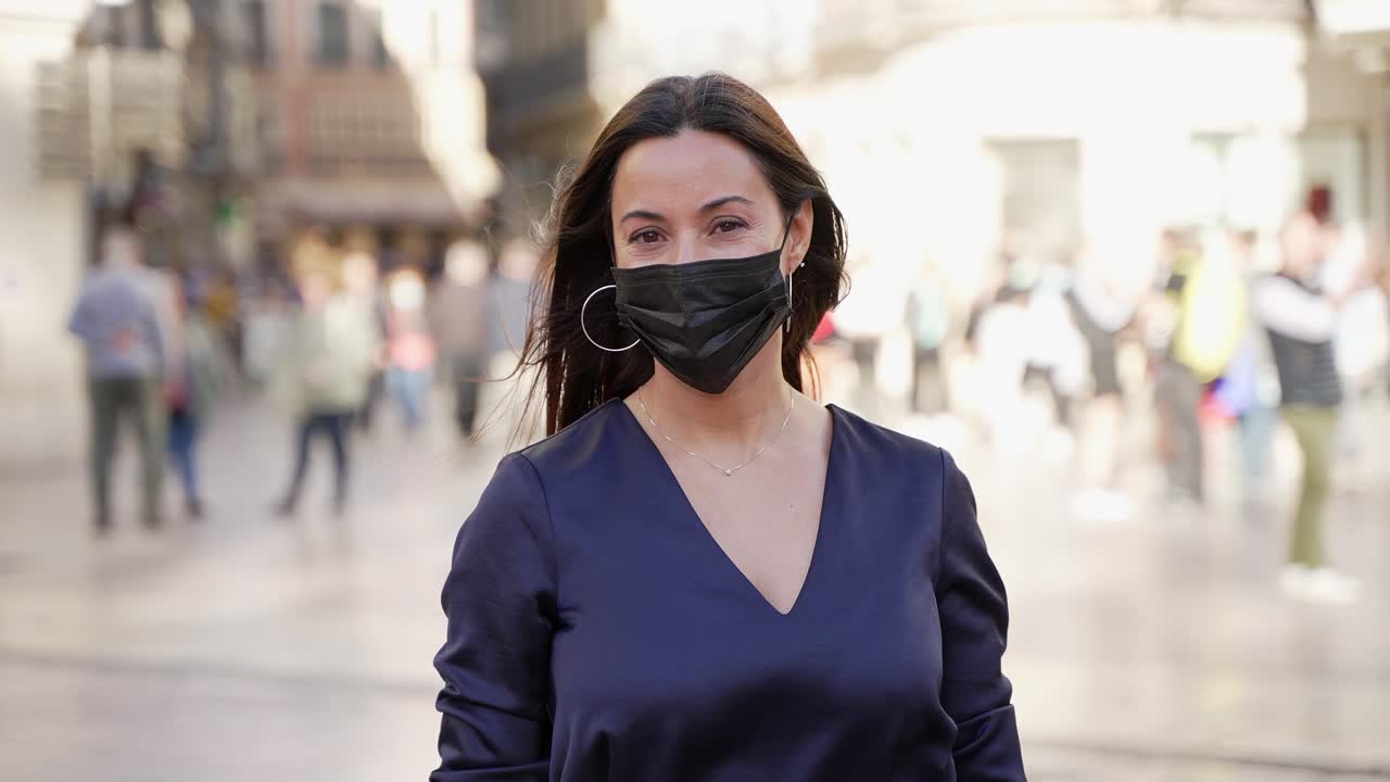 Woman Wearing Mask in City Street