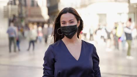 woman wearing mask in city street