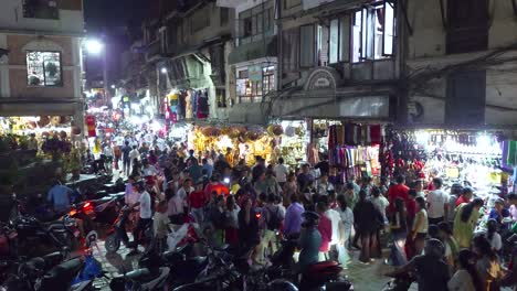 crowded shopping street at night in the city center of katmandu, nepal. - wide shot