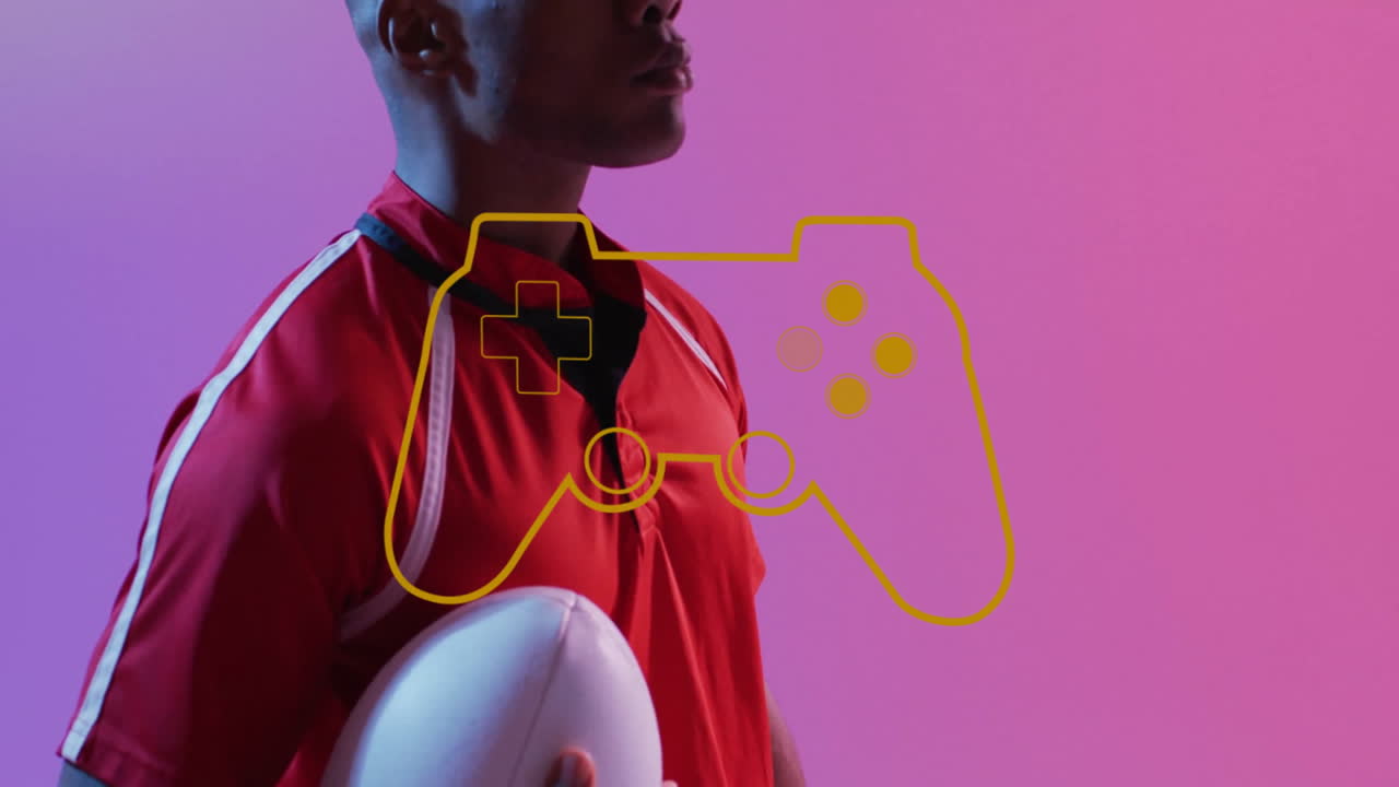 Holding rugby ball, athlete with game controller animation over pink background