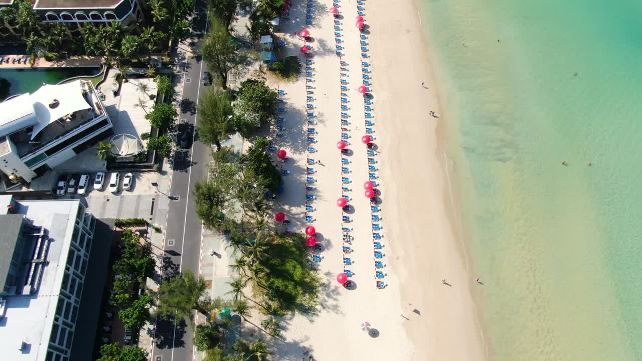 Top view  beach with straw umbrellas. Golden sands sea summer.