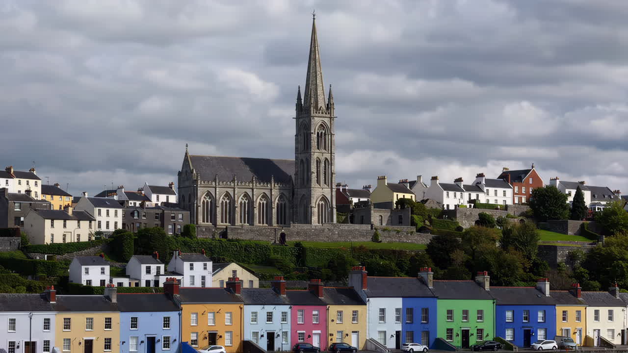 St. Colman's Cathedral overlooking colorful houses in Cobh, Ireland
