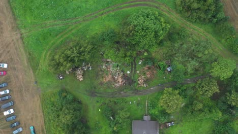 Cars-parked-on-agricultural-field-during-family-gathering-yard-cleaning