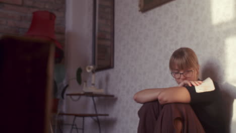 sad woman sitting in retro interior