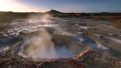 Steam-From-Mud-Pools-In-Geothermal-Land-At-Daytime-In-Reykjanes-Peninsula,-Iceland