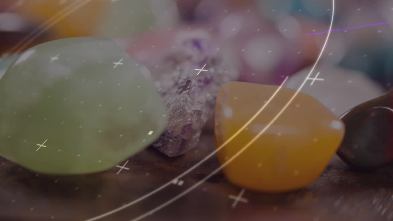 Polished gemstones cluster rotating over wooden surface, showing amethyst and HUD overlay graphics