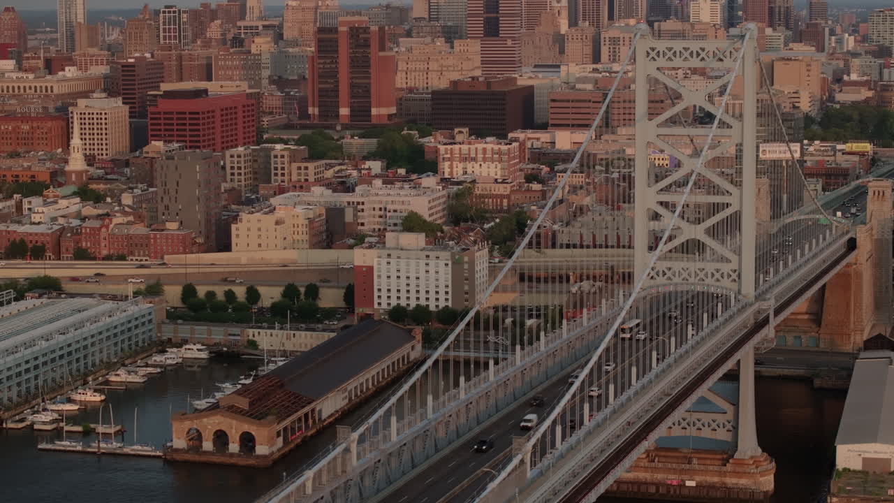 Aerial view of Philadelphia's Ben Franklin Bridge. Shot along the Delaware River at sunrise on a summer morning