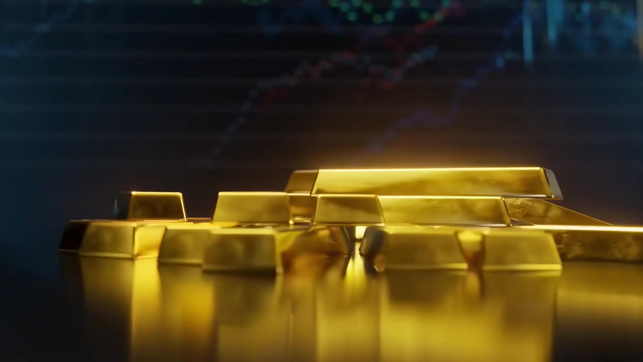 背景に金融市場データが映る金塊のクローズアップ。