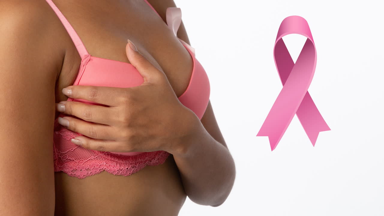 Animazione di nastri rosa del cancro sopra donna birazziale