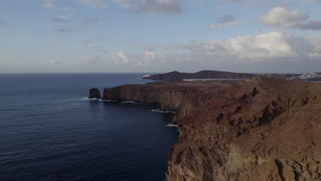 fantastic aerial shot approaching the coast and cliffs during sunset and where you can see the partido cliff on the island of gran canaria