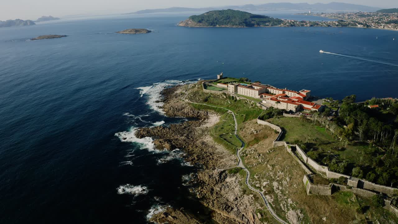 Panoramic Aerial View Of Hotel On Top Of Coastal Hill Overlooking The Ocean and Baiona City In Spain