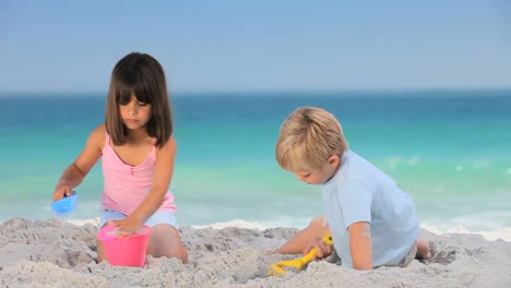 children building a sand castle