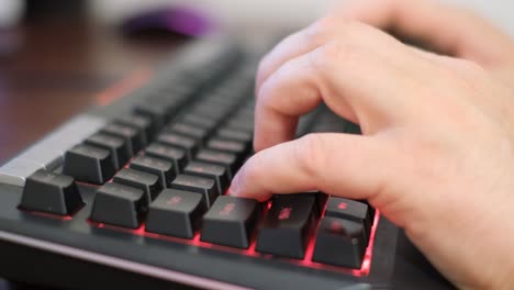 Computer programmer typing code on a flat keyboard. Computer programmer typing code on a flat keyboard