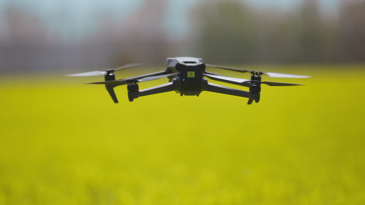 Drone flying over a yellow field