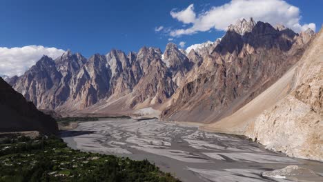 aerial shot above hunza river, passu cones mountains in background