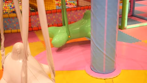 colorful indoor playground with swings