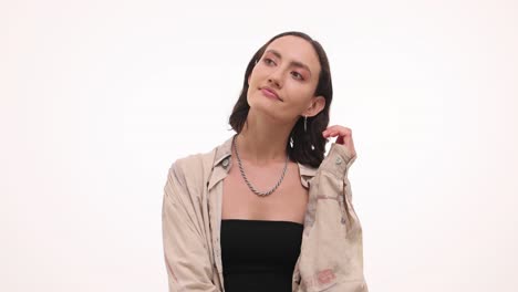 a series of studio portraits of a young woman posing and contemplating