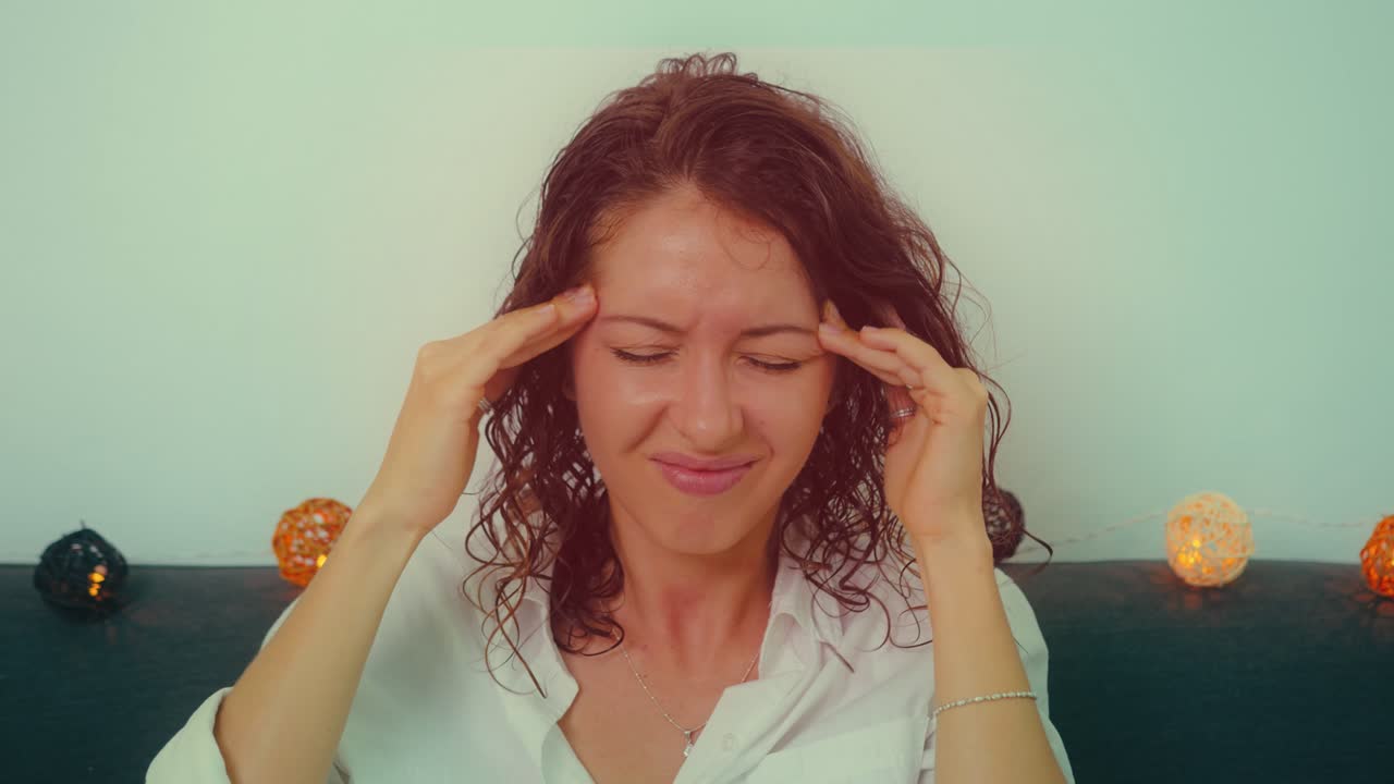 Woman with Curly Hair Experiencing Discomfort