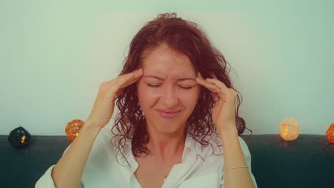 woman with curly hair experiencing discomfort