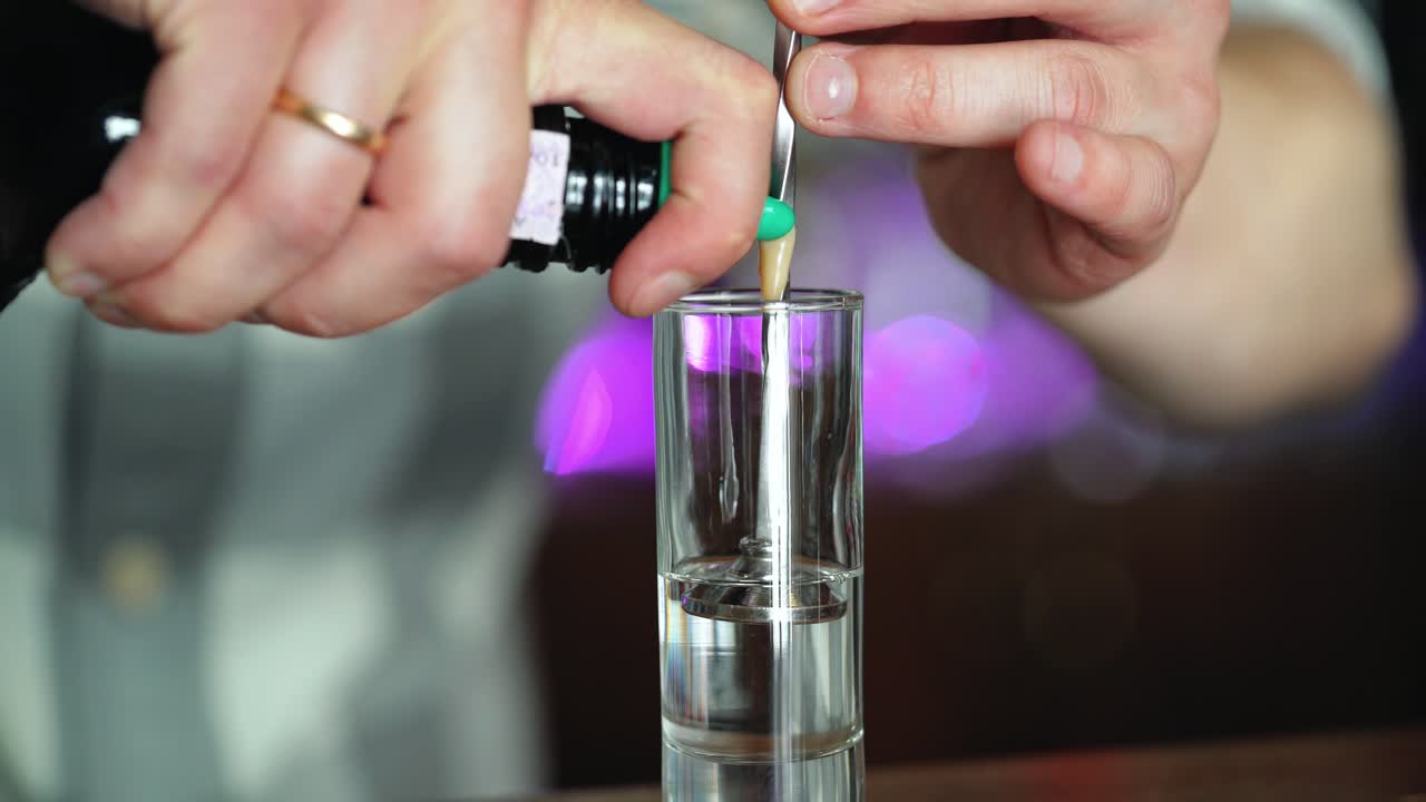 Barman or bartender preparing alcohol cocktail in restaurant