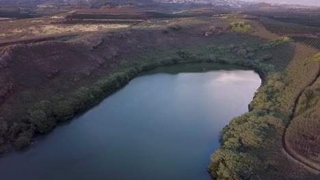 Tranquil-Waters-And-Green-Foliage-At-Salt-Pond-Park-In-Hawaii---aerial-drone