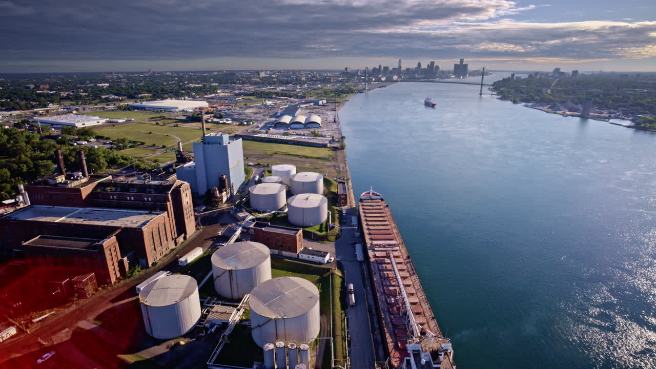 Aerial view capturing a freighter on the Detroit River with the bridge in the background