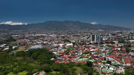 establishing drone shot over the cityscape of san jose, sunny day in costa rica