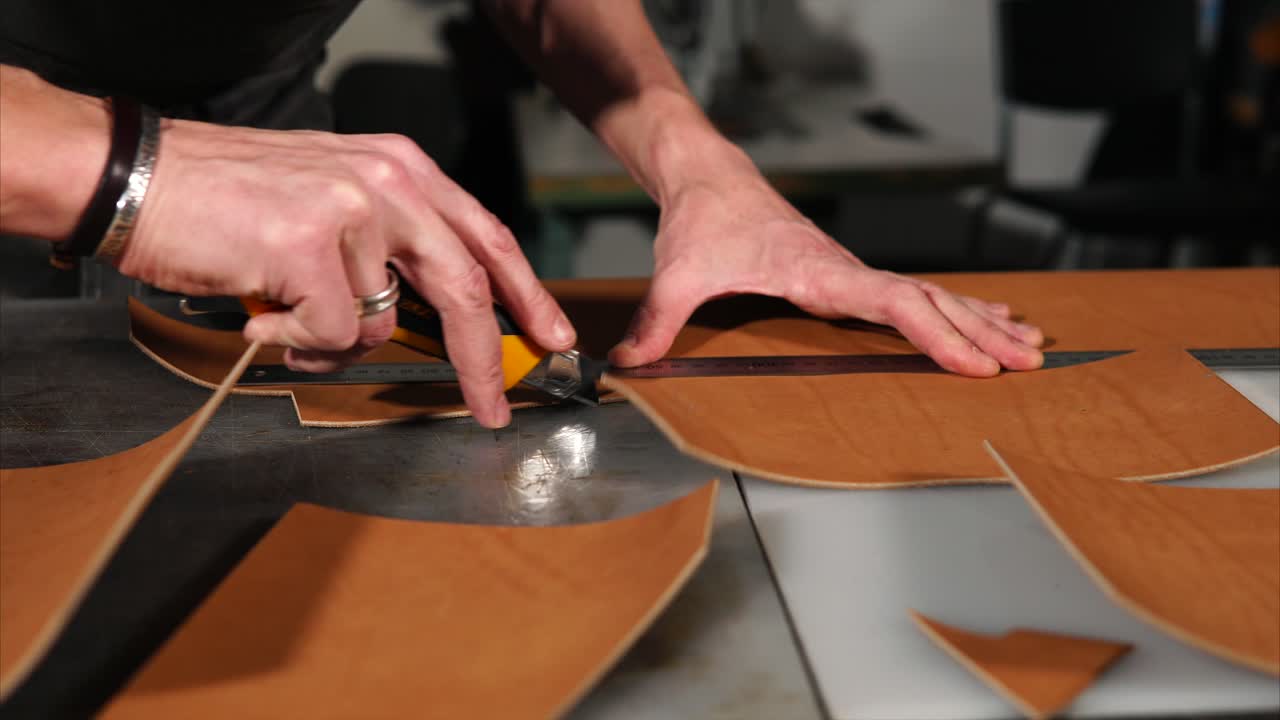 Leather Craftsman Cutting Leather Pieces