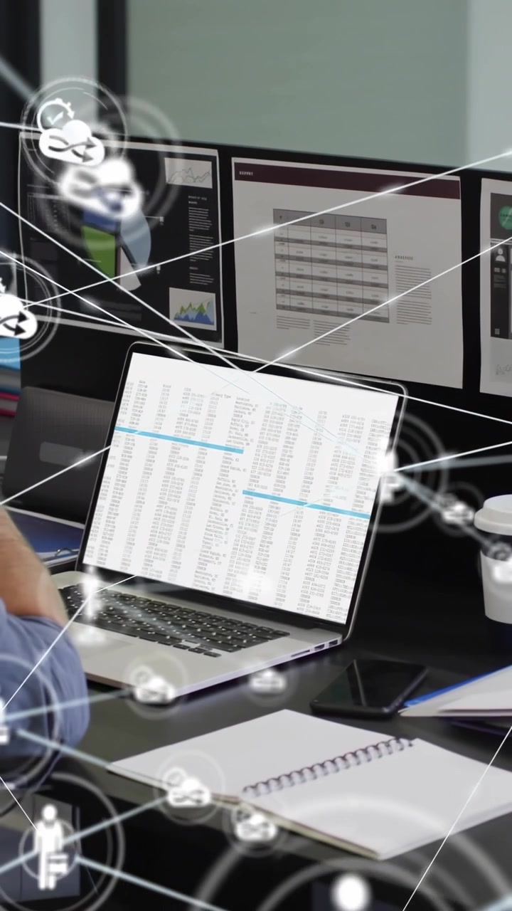 Vertical video: Analyst typing on laptop, sparking biz network linking screens to show spreadsheet