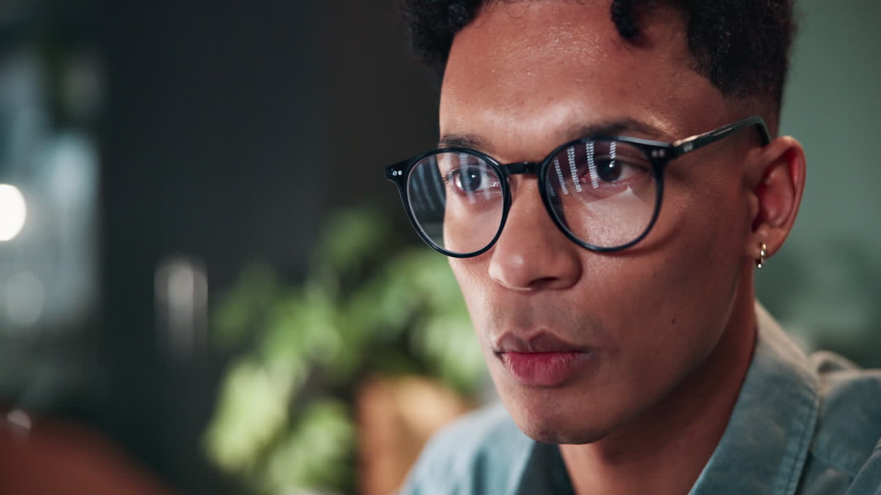 Close-up of a man working late at night