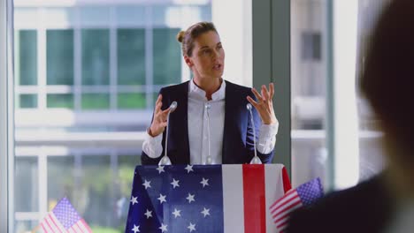 Female-speaker-speaks-in-a-political-campaign-seminar-at-modern-office-4k