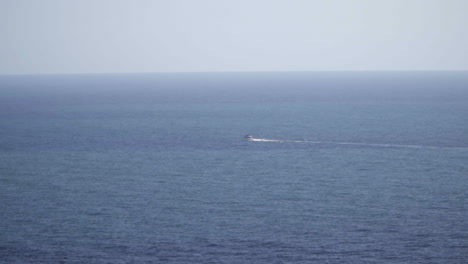 small boat on a calm ocean