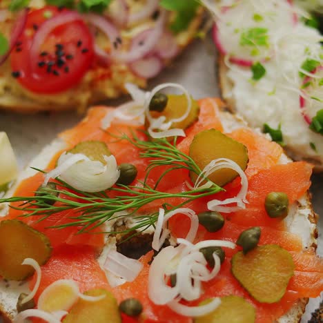 assortment of different kinds toppings homemade bagels sandwiches with sesame and poppy seeds