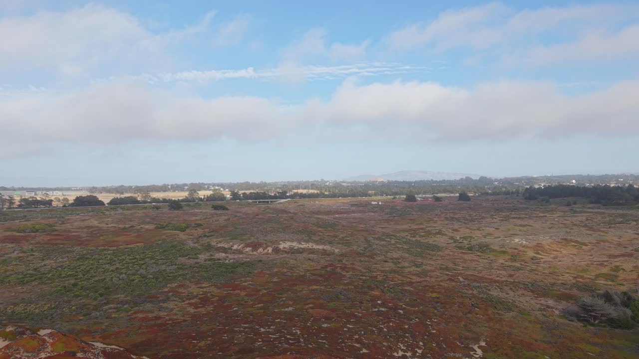 Fort Ord’s open land fades into the horizon, where Highway 1 quietly parallels the Pacific’s edge.