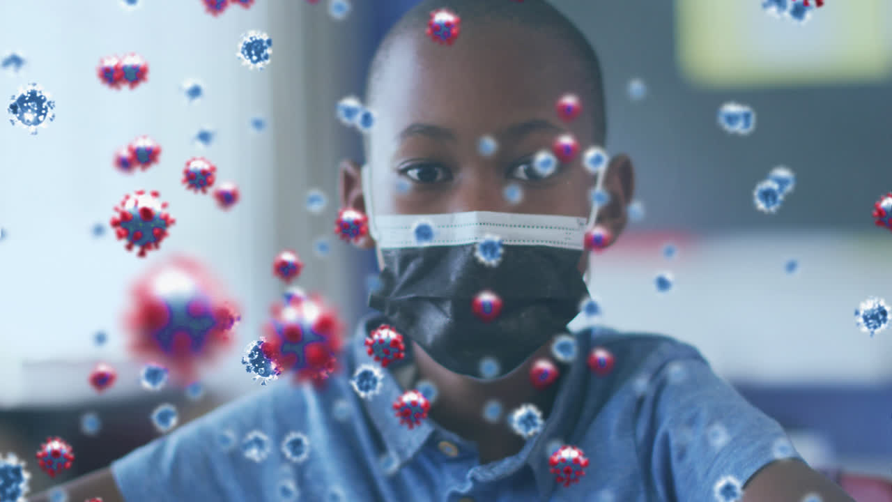 Animation of covid 19 cells over african american schoolboy in face mask