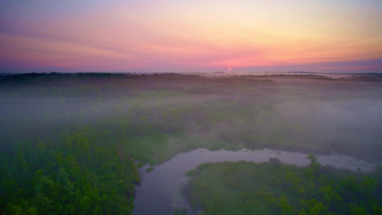 A misty morning over the Huron River near Milford, Michigan, seen from the air.