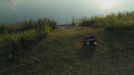 fishing rods on lakeshore near frydman village, poland