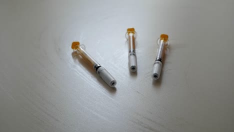 three syringes on its containers