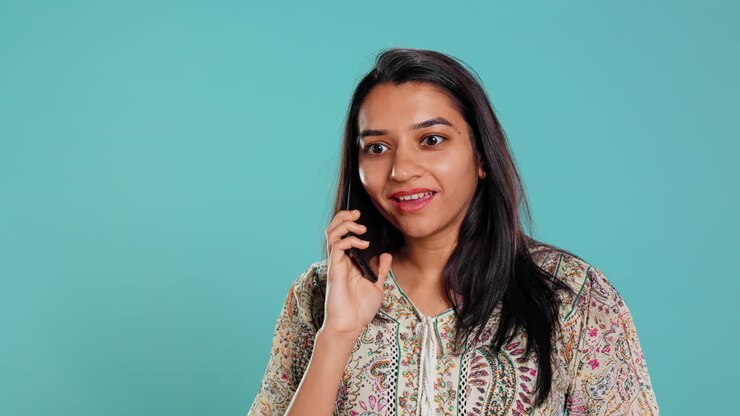 Woman swiping on smartphone touchscreen to answer phone call