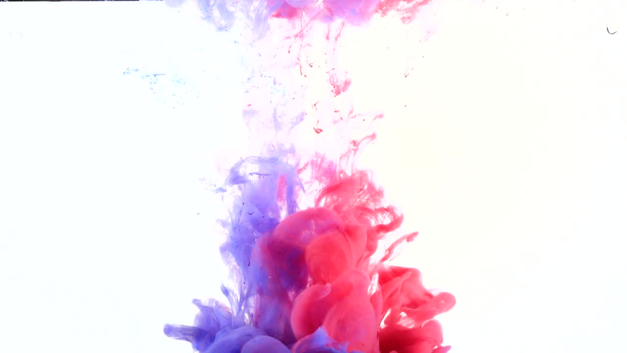 Red and blue paint squirted into water tank