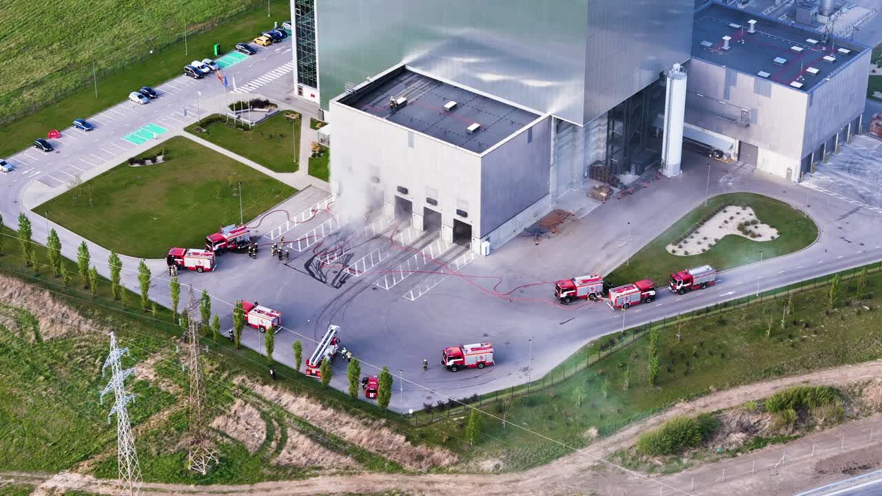 drone footage of emergency responders at the Kaunas power station. Visible smoke and active response.