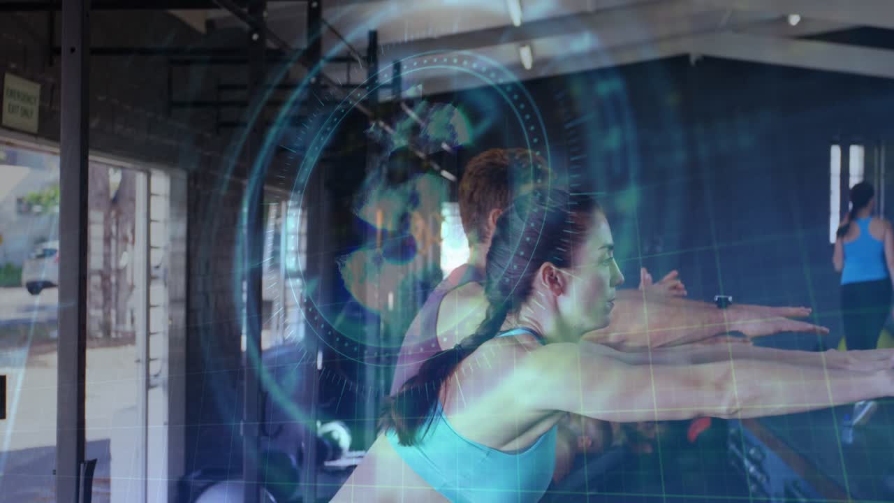 Gym group squatting, swinging arms, launching plyo box jumps holographic overlay showing strength