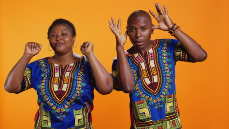 african american silly couple fooling around on camera