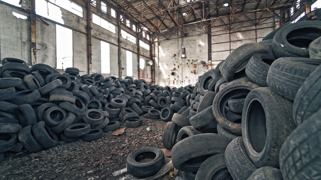 Old damaged tires after driving. Stack of car second used car rubber tires